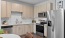 Stainless steel appliances in apartment kitchens at Adams Hill