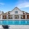 Resort-style swimming pool with lounge seating